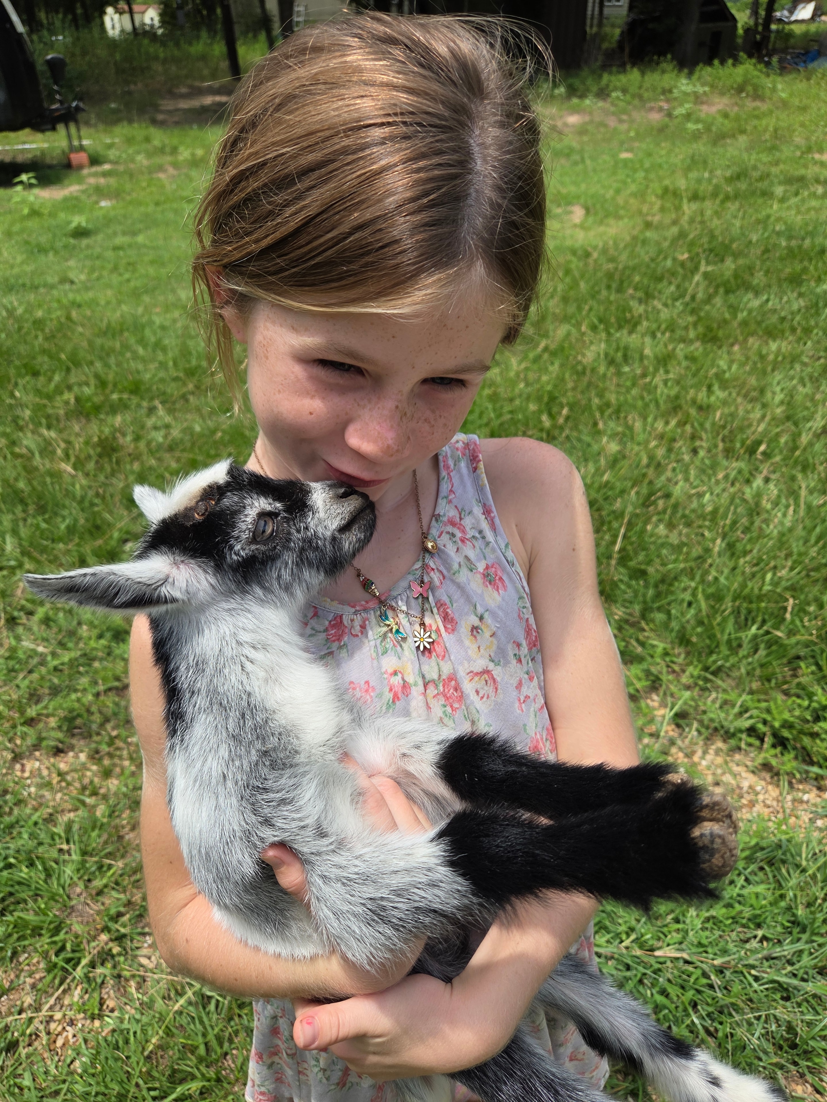 Girl with baby goat